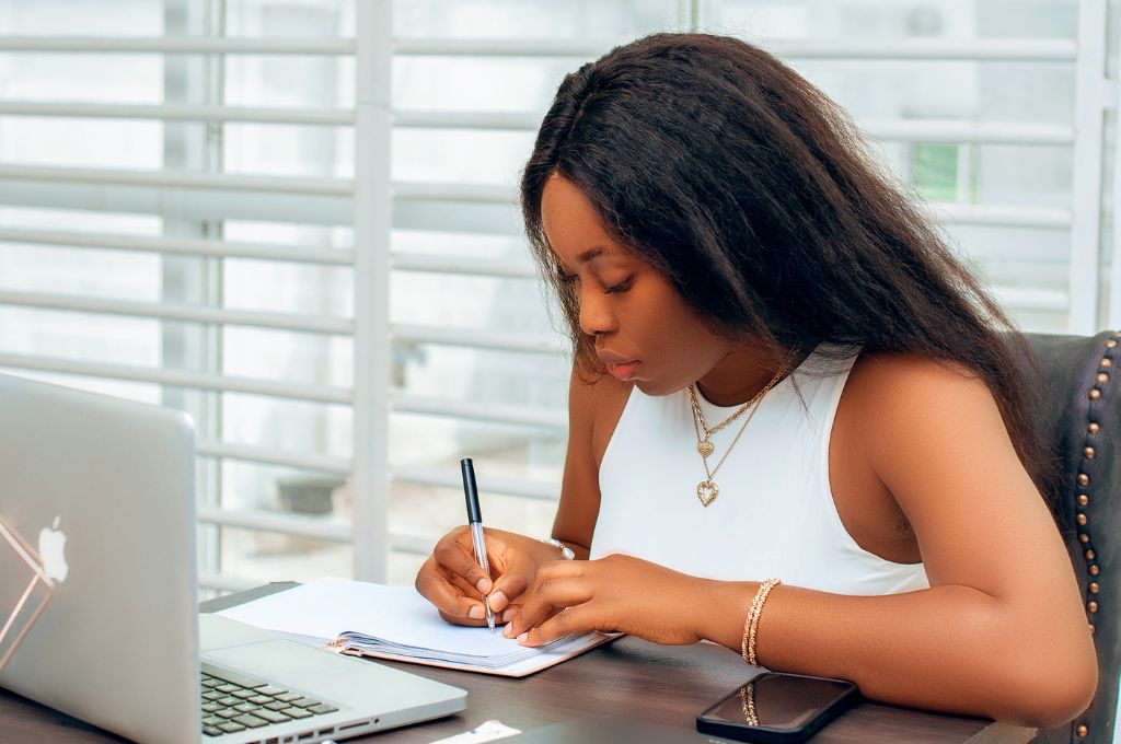 Sally Ofuonyebi, Website Copywriter, writing copy for a client's website.