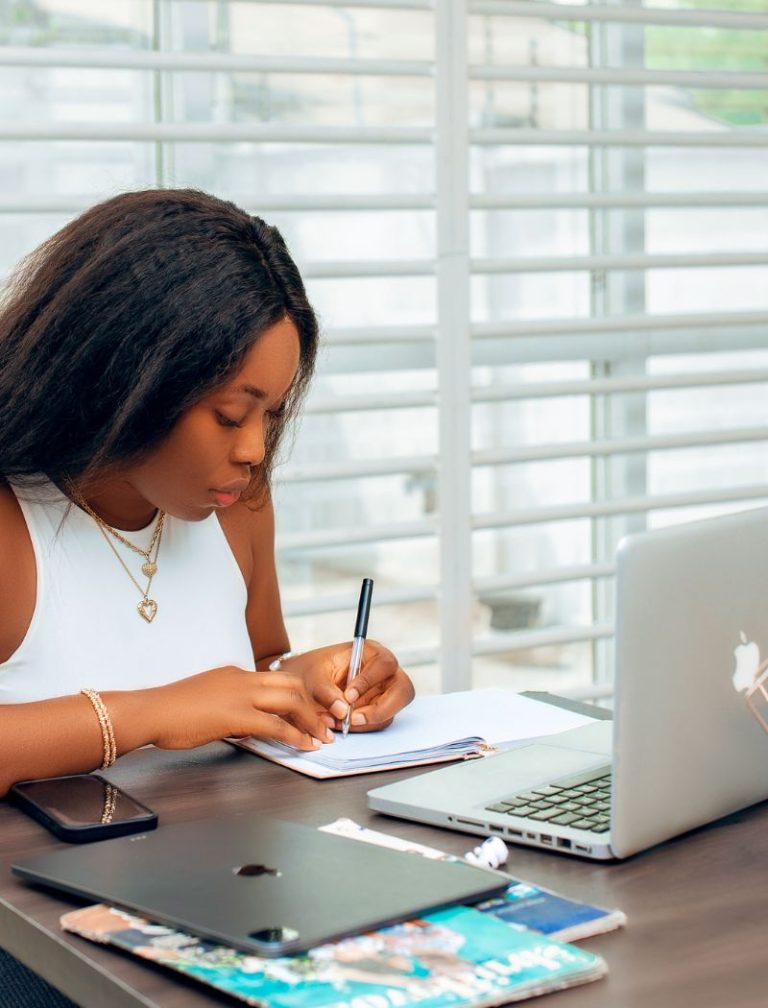 Sales funnel copywriter, Sally Ofuonyebi, working on a client project.